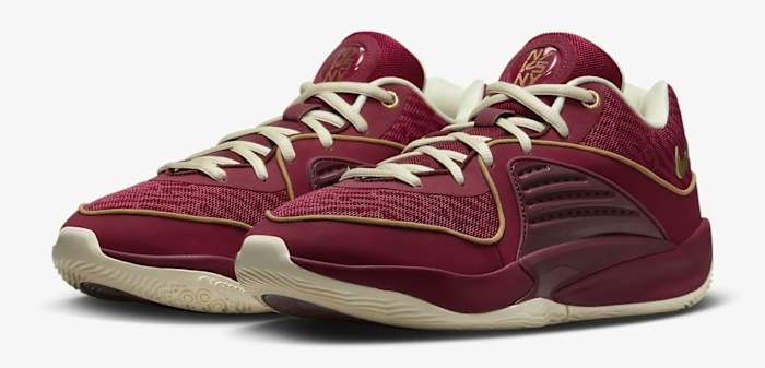Side view of Kevin Durant's red and gold basketball shoes.
